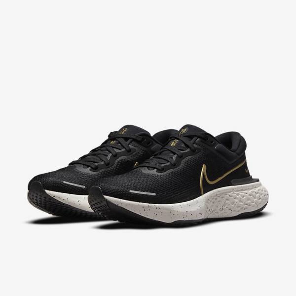 Black / Metal Gold Men's Nike ZoomX Invincible Run Flyknit Road Running Shoes | NK523LWO